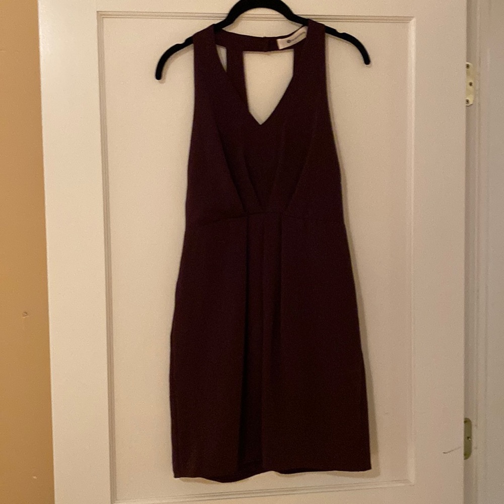 Dark maroon dress with black lace detail on the side